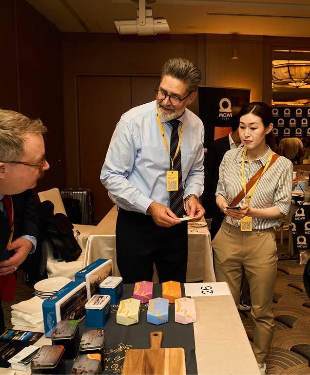 Two-men-and-a-woman-at-a-trade-show